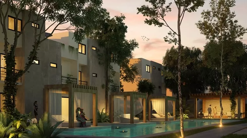 Facade of several houses and a swimming pool at Fabula Tulum