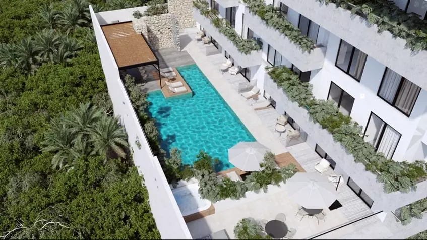 Aerial view of a pool with sundeck at Dharana Tower Cancun
