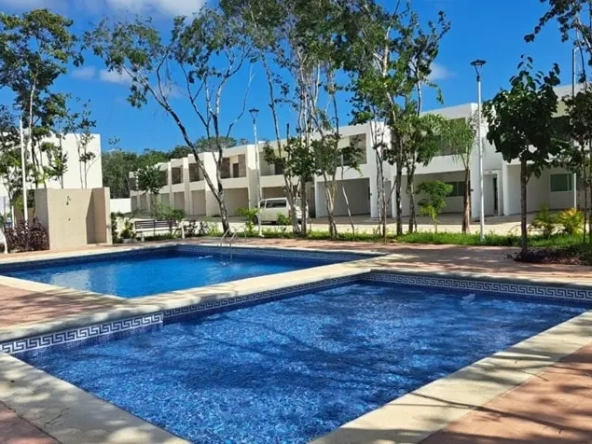A swimming pool and splash pad for children at Villas Bonanza