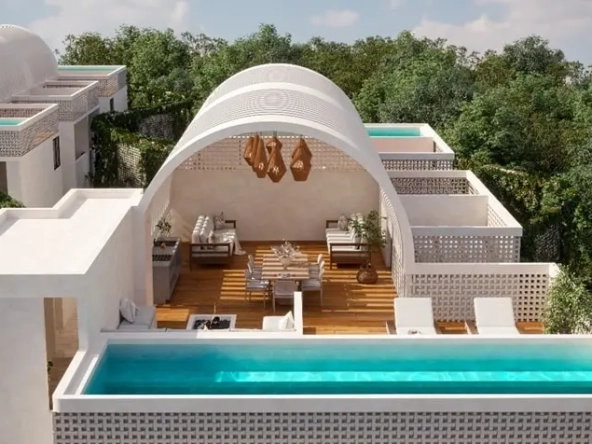 Aerial view of a terrace with pool and lounge area in Kaab Tulum