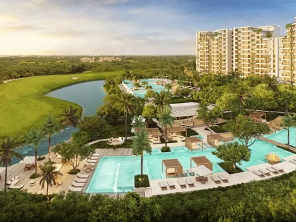 Aerial view of a swimming pool and apartment towers overlooking the golf course in Punta Laguna