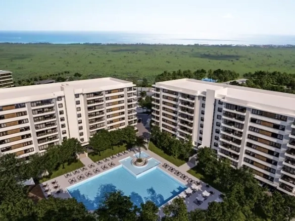 Aerial view of a real estate development with a pool in the middle in Vanguardia Puerto Morelos