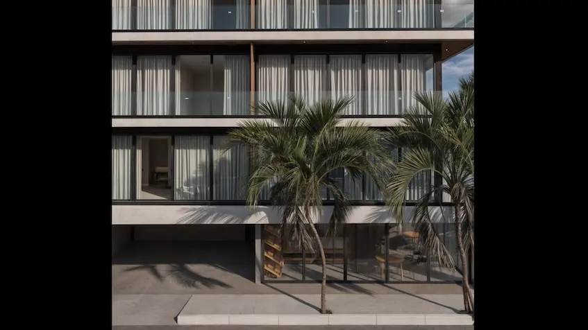 A building with palm trees in Macondo Punta Esmeralda Playa del Carmen