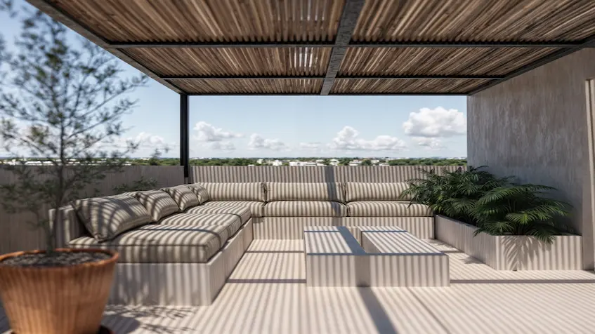 A Rooftop with a couch and a table in Macondo Punta Esmeralda Playa del Carmen
