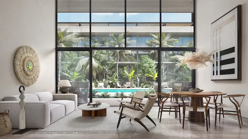 A living room with a large window in Legacy By Awa Playacar