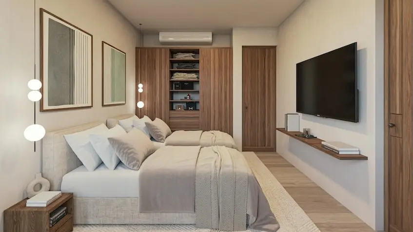 A Interior Bedroom with a tv and a bed in Oceanna Residences Playa del Carmen