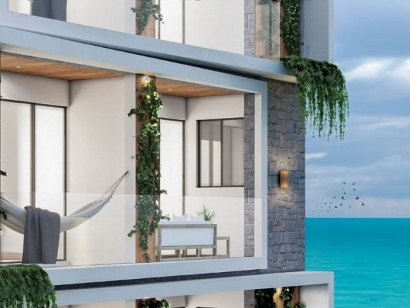 Vista de terrazas con balcón con hamaca o una mesa pequeña y vista al mar en Xkaa Ocean View Condos