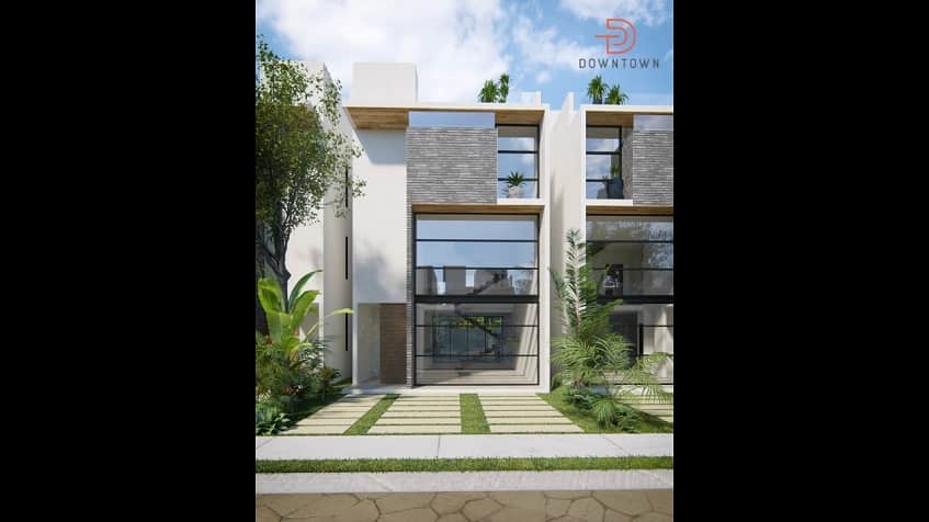 Fachada de casa con estacionamiento al frente en Downtown en Tulum
