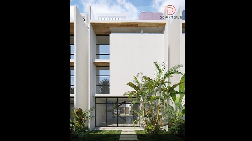 Fachada de casa con mini jardín al frente en Downtown en Tulum