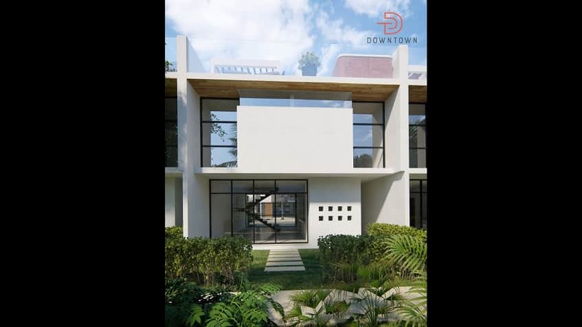 Fachada de casa con mini jardín al frente en Downtown en Tulum