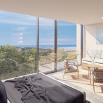 Bedroom with terrace and large window overlooking the garden and ocean at Kaab at South Beach