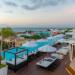 Rooftop pool with ocean view bar at The Fives Downtown