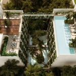 Aerial view of a residential building with swimming pools and green areas at Syrena Studio Living