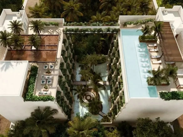 Vista aérea de edificio residencial con piscinas y áreas verdes en Syrena Studio Living
