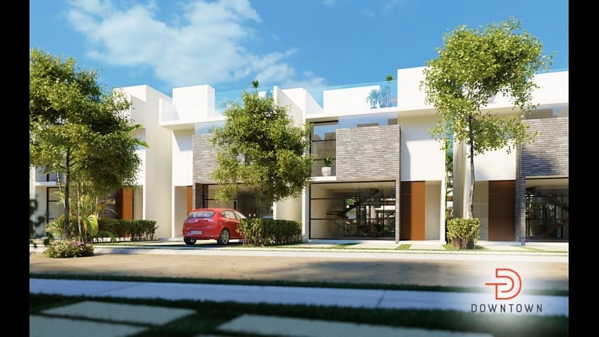 Vista frontal de las fachadas de las casas con estacionamiento al frente en el Centro en Tulum