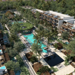 Residential condominium with two large pools and recreational areas in between in Amana Tulum