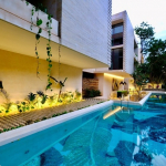 Facade of a residential building and swimming pool, common terrace at Casa Libre Airena