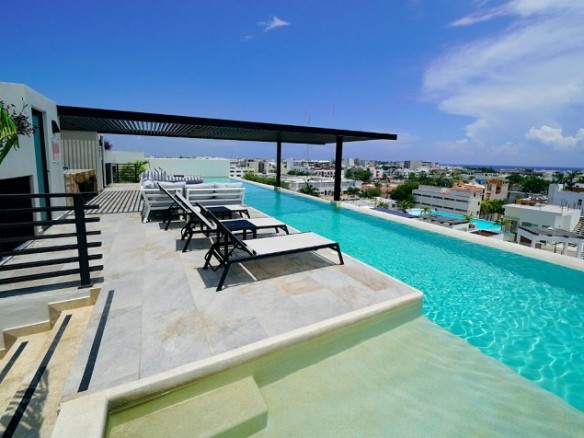 Rooftop pool with city views at Arenis Condo Living