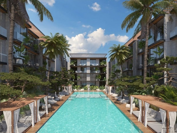 Ground-floor pool, garden, and surrounding residential building in Bakal Tulum.