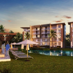 Edificio residencial con lago al frente y pareja de ancianos bajo pérgola solarium en Torre Avia Country Village