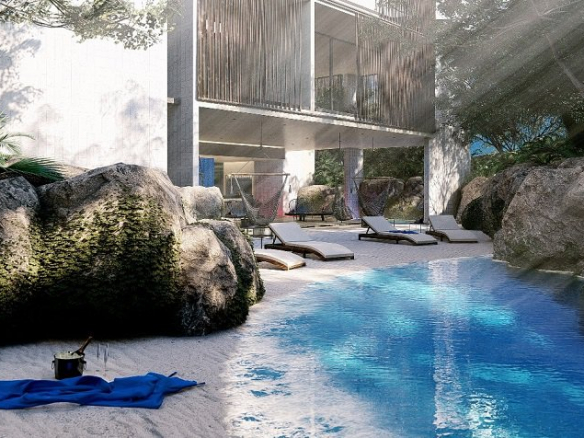 Cenote surrounded by rocks and a mini beach with a bottle of champagne in Iik Tulum