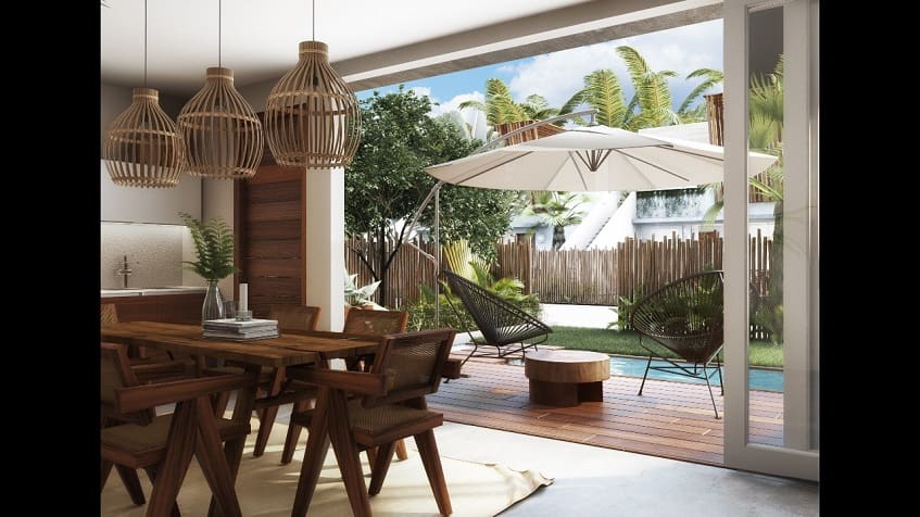 Interior of the house with dining table and view of the terrace at Asana Leaf Tulum