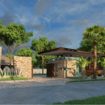 Main entrance gate with logo surrounded by vegetation in Xaman Ha