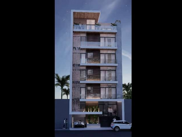 Vista frontal del edificio residencial con balcones en Ahal Riviera Maya