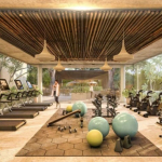 Large indoor gym with glass walls and jungle views Ophelia Tulum