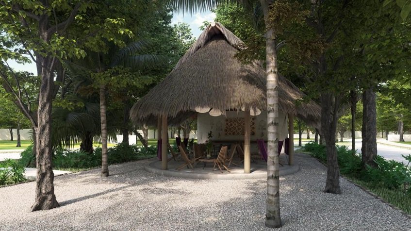 Palapa redonda con hamacas, mesas y sillas en Mirador Tulum