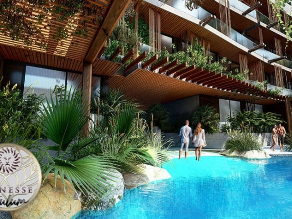 Central courtyard and two couples walking by the pool at Menesse Tulum