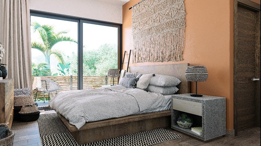 Dormitorio con decoración artesanal sobre la cama en Aleda Playa