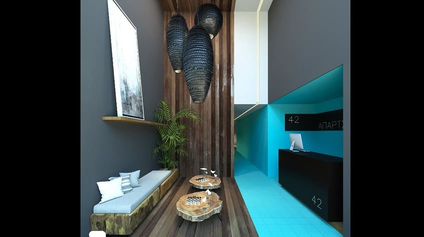 Mostrador de recepción decorado en azul, gris y madera en Oxygen 5th. Ave. Residencias