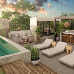 Rooftop pool and terrace next to the bar at Irie Tulum