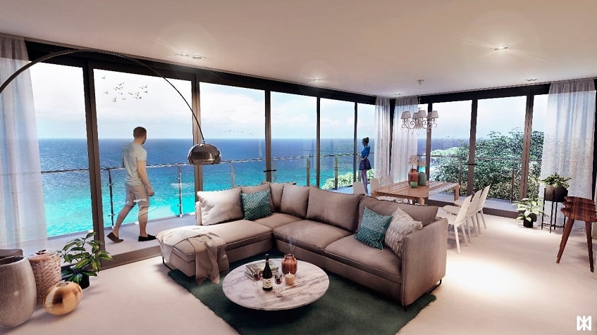 Sala de estar con vista al mar y un hombre mirando por la ventana en The Maria Cozumel