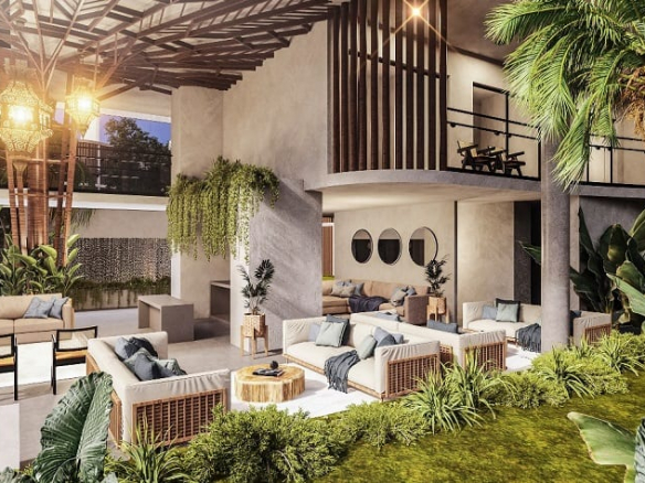 Relaxation area with sofas in the garden at Kikaab Tulum