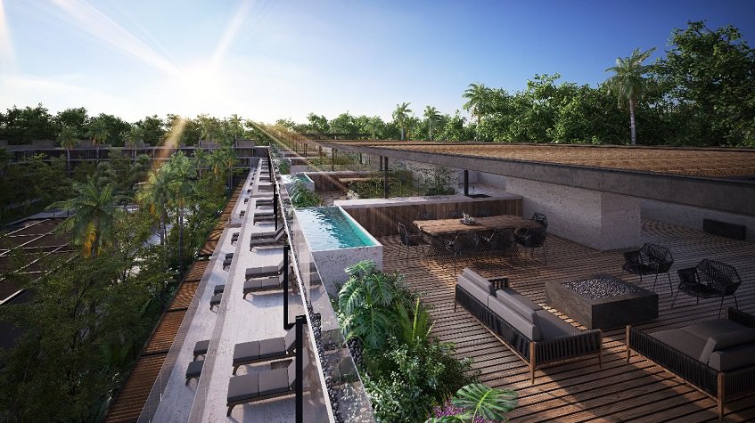 Terraza lounge en la azotea con dos piscinas y pergola en Awa Playacar Residences