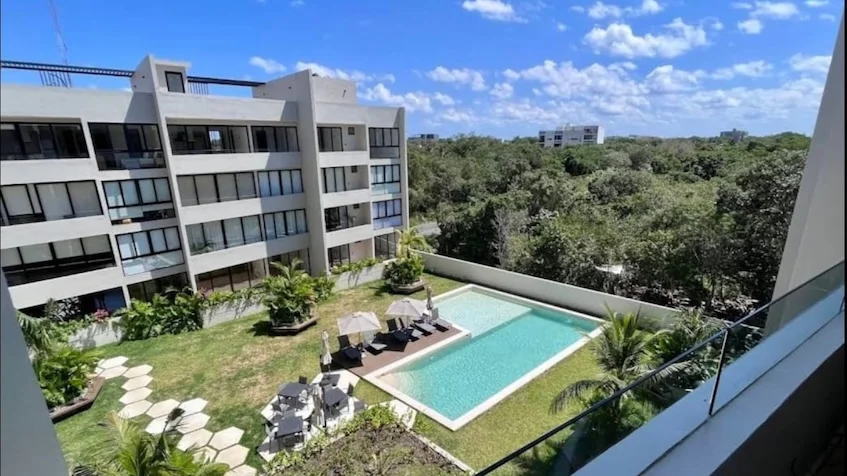 Vista alberca Jardin en Wave Living Playa del Carmen