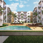 Bâtiments résidentiels autour d'une grande piscine avec terrasse ensoleillée à Lu'xia Residential