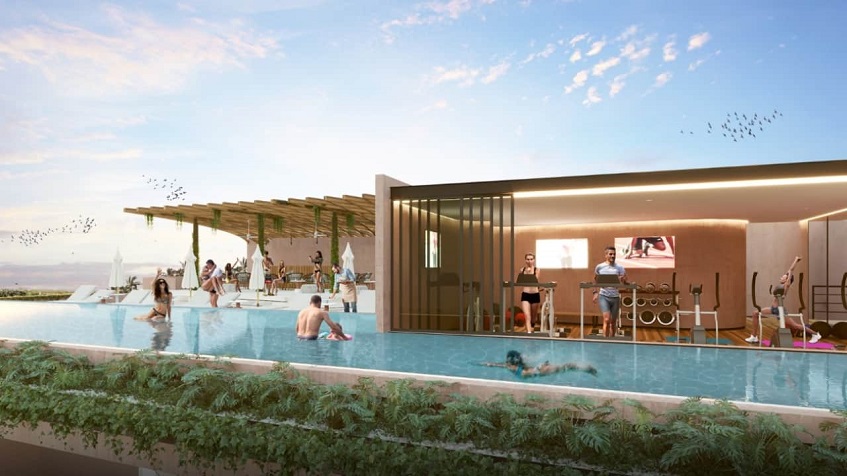 Terraza de madera y piscina en Ixuh Beach Living