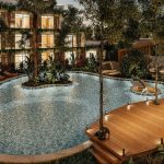 Pool with sundeck at night at Meraki Tulum