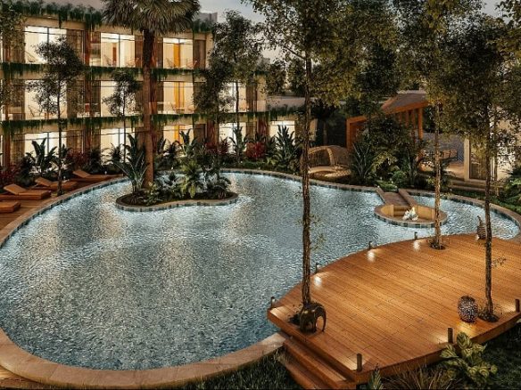 Pool with sundeck at night at Meraki Tulum