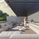 Terrace with lots of white cushions and pool at Naraina Akumal