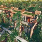 Red-fronted houses with grass on the roofs of Aldea Savia
