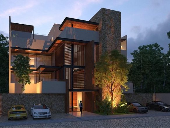 Facade of the night building with parking in Kalmuk Tulum