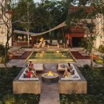 Fire pit and pool garden with a group of people in Xibalba