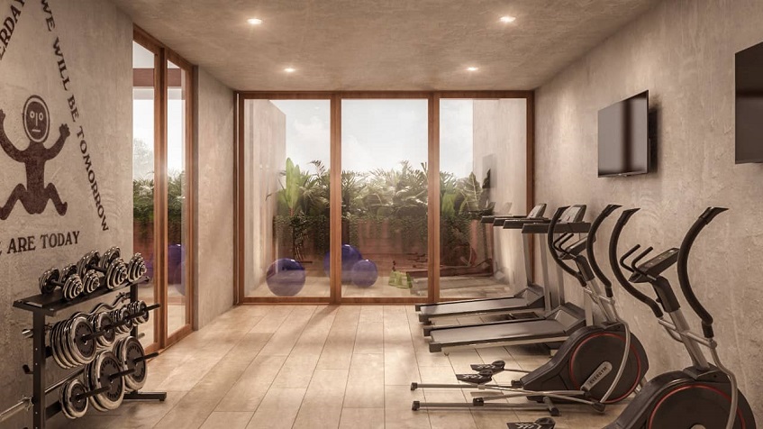 Indoor gym with treadmills and other exercise tools in Bacab Tulum