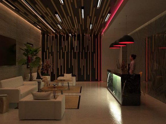 Recepcionista en recepción en el lobby de Amour Tulum