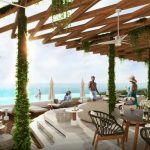 Club de la azotea con gente relajandose en Ixuh Beach Living