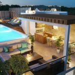 Large lounge area with bar and pool on the rooftop of the Nordic Light Condominium